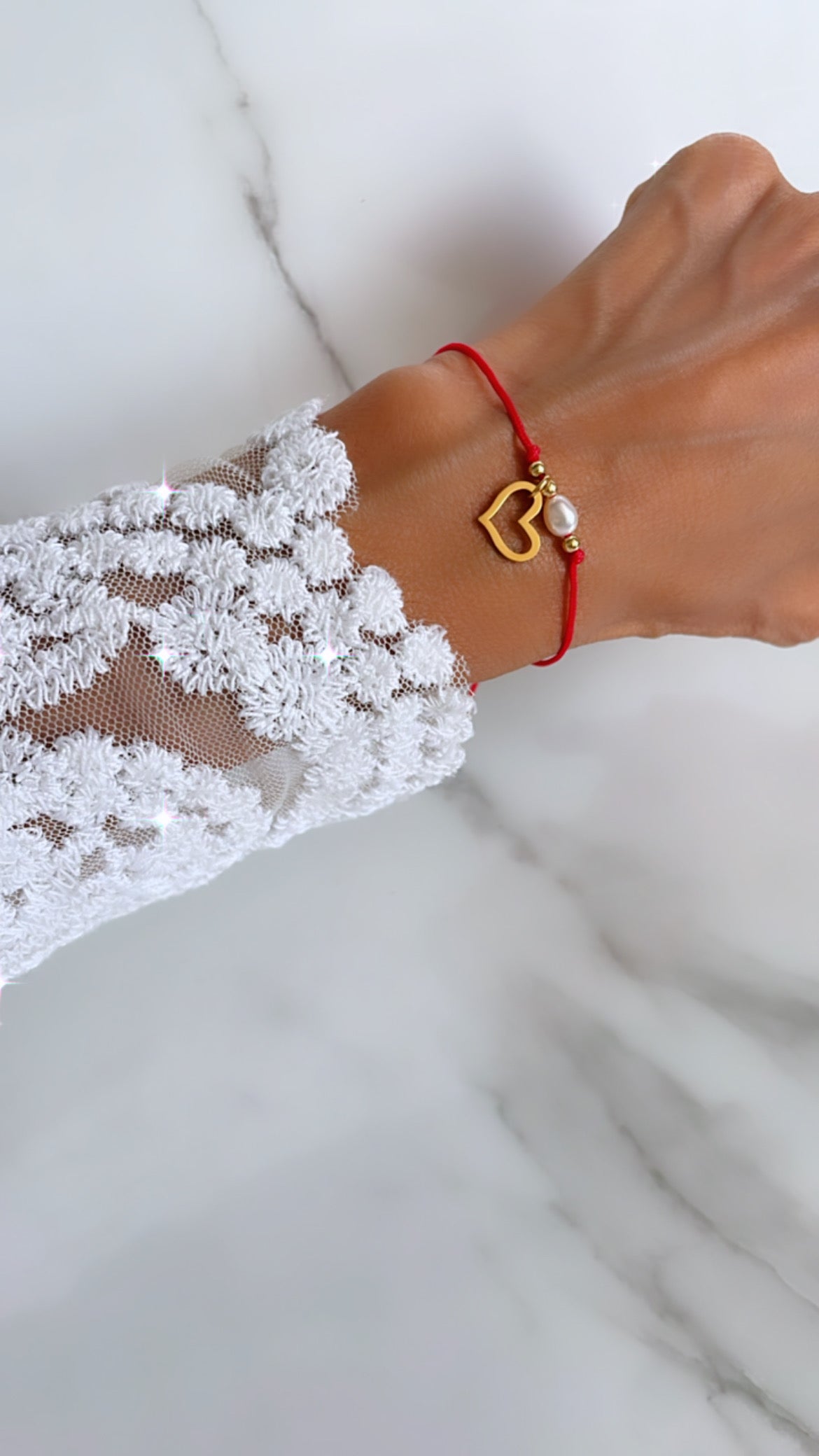 Pulsera  hilo corazón perla