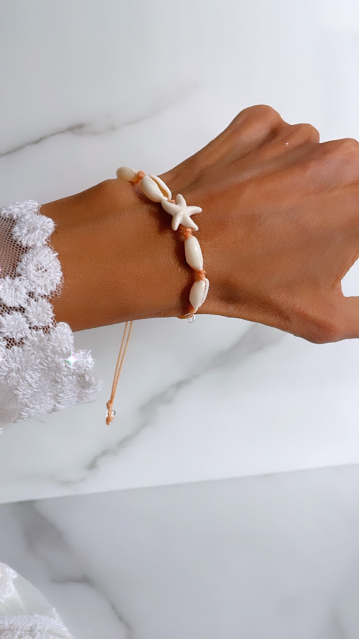 Pulsera hilo conchitas y estrella