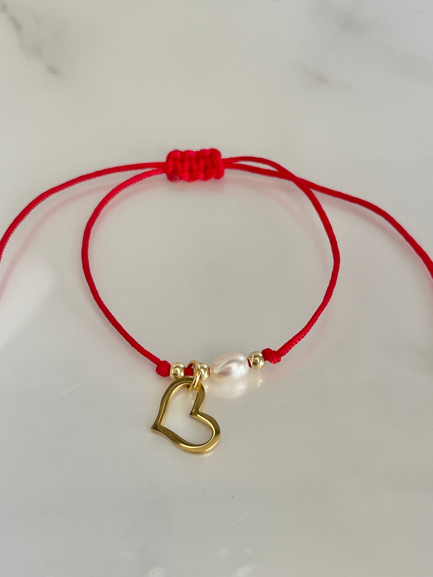 Pulsera  hilo corazón perla