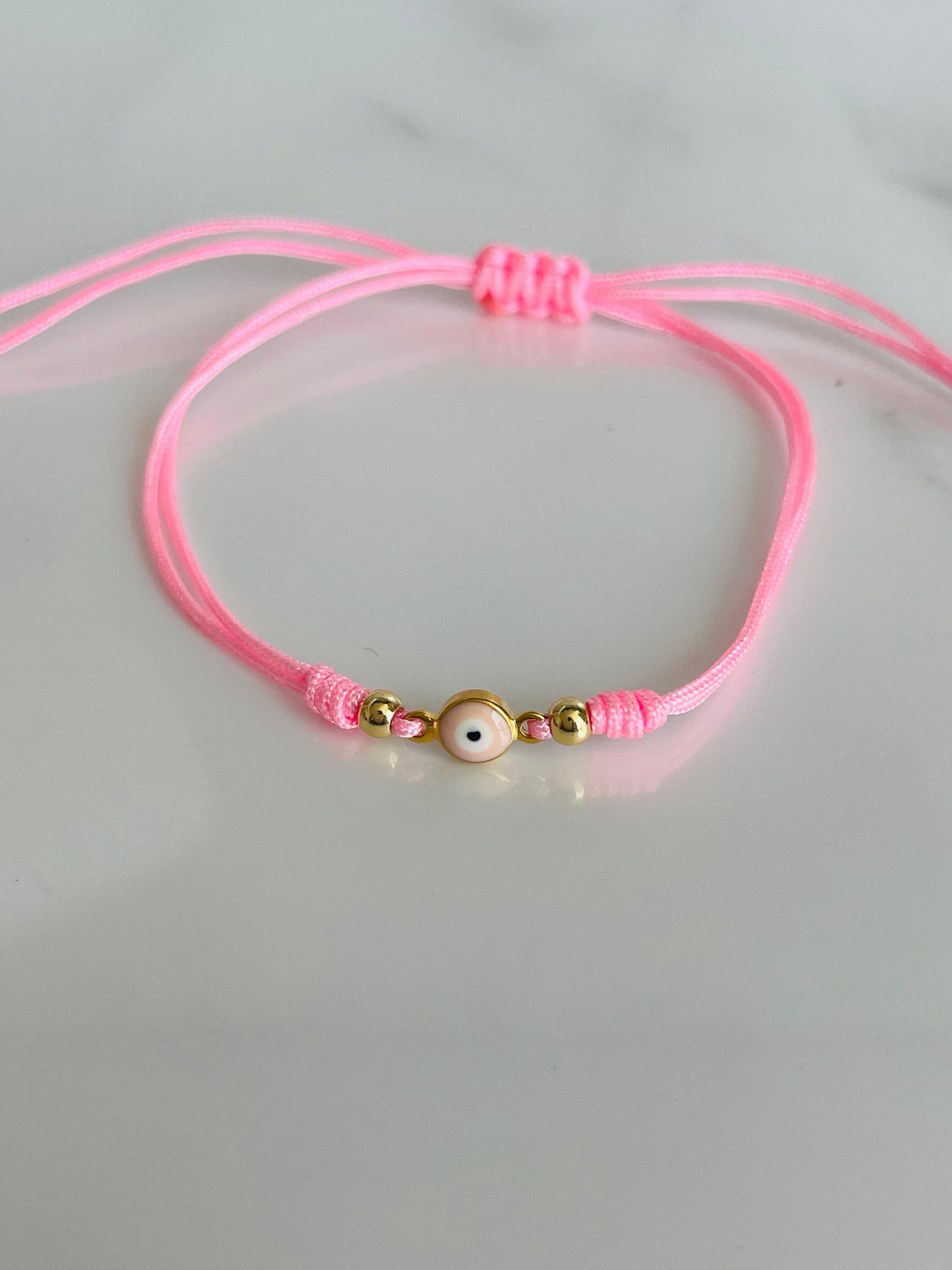 Pulsera hilo ojo turco rosada