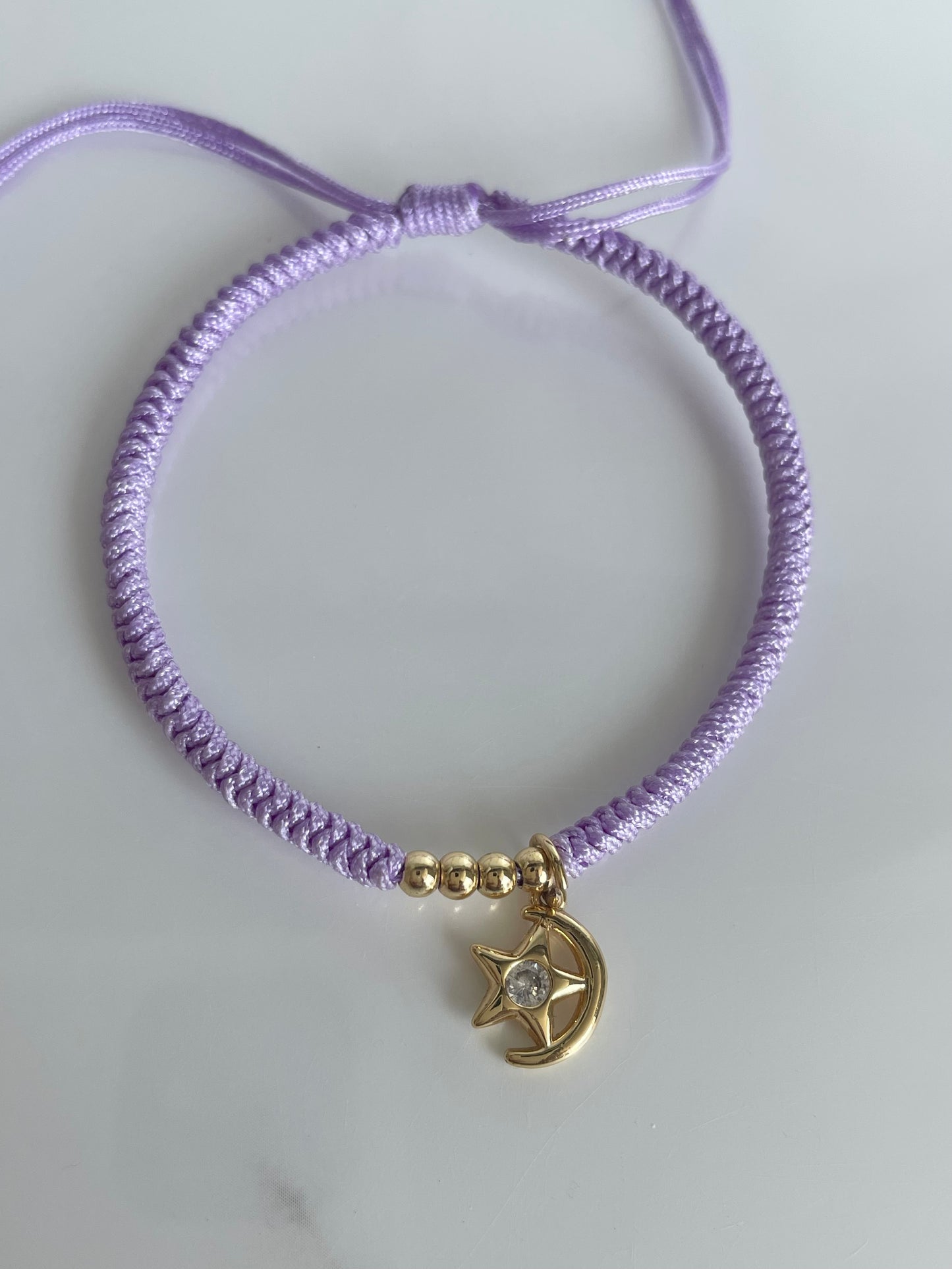 Pulsera tejida lila estrella luna