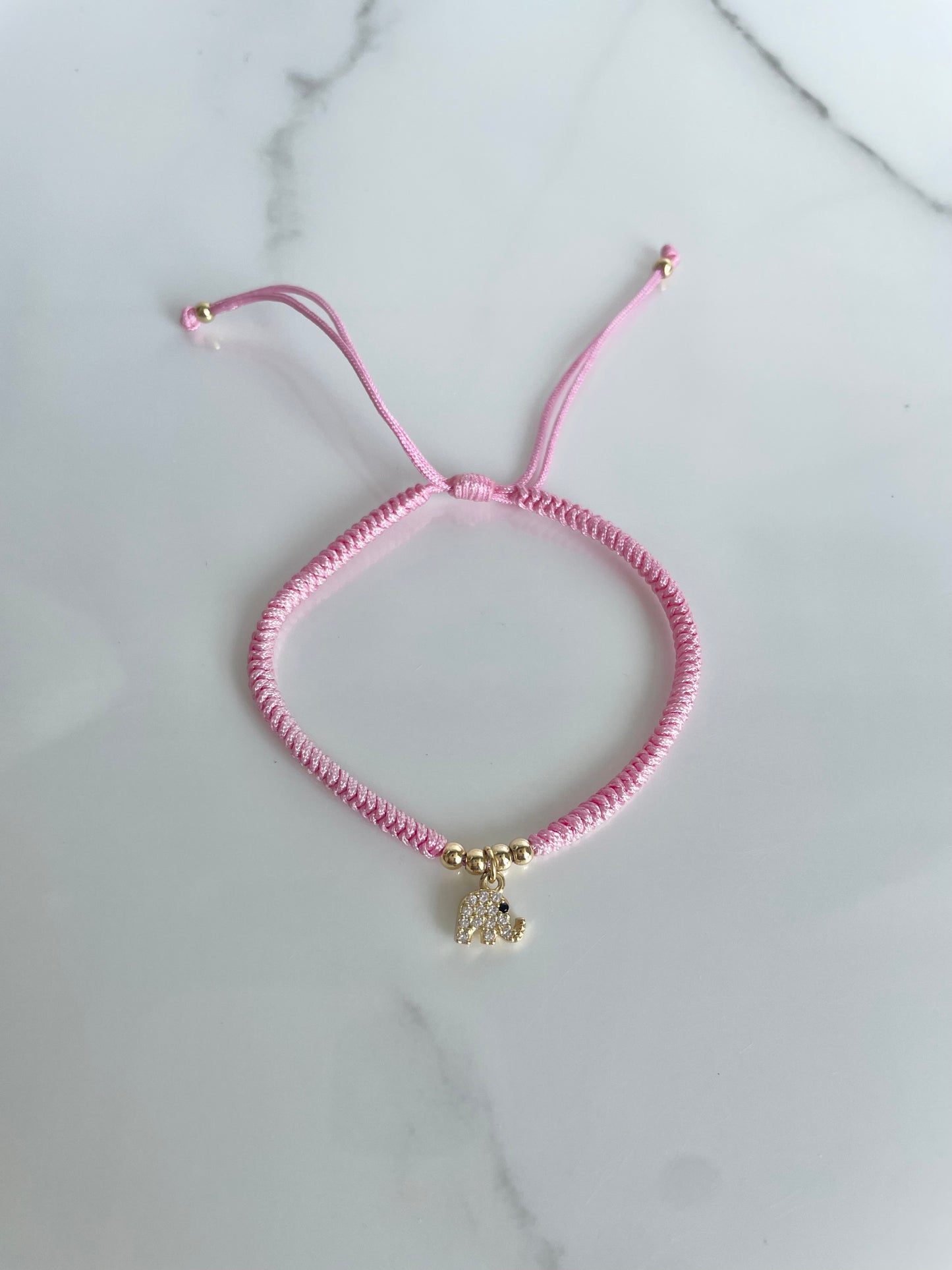 Pulsera tejida rosada elefante