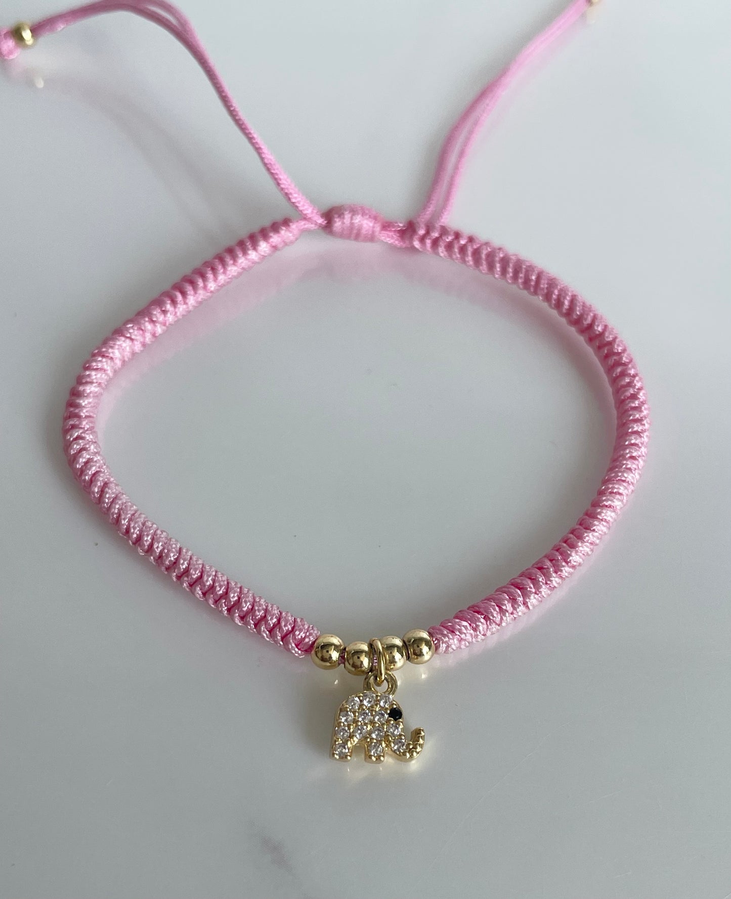 Pulsera tejida rosada elefante