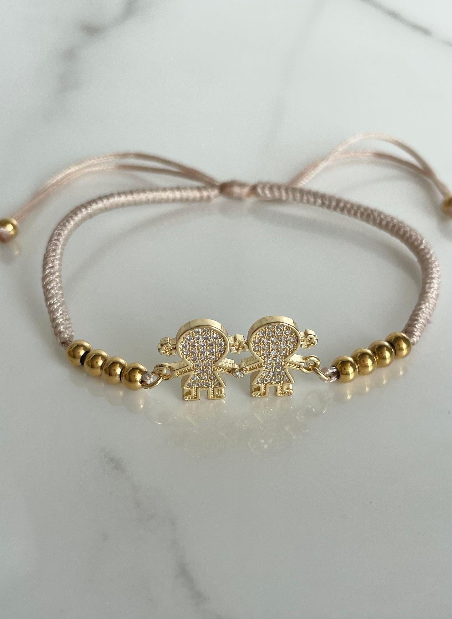 Pulsera tejida beige niñas