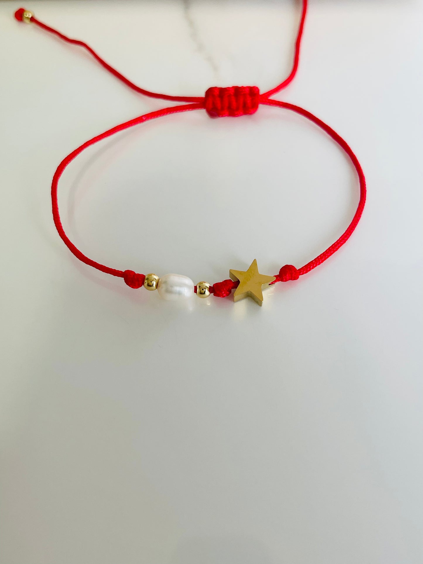 Pulsera  hilo estrellita perla